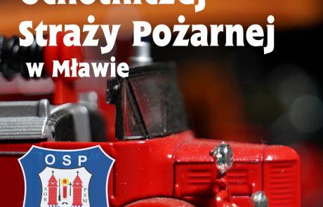 Przód zabawkowego samochodu strażackiego, herb OSP Mława, napis: 140 lat Ochotniczej Straży Pożarnej w Mławie